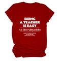 Detail of dark red cotton T-shirt featuring white Being A Teacher Is Easy slogan print - Red (White Font)