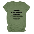 Detail of olive green crew neck teacher slogan t-shirt showing soft fabric and black print - Olive Green (Black Font)