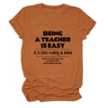 Close-up of heather rust teacher t-shirt fabric texture and high-quality black print - Burnt Orange (Black Font)