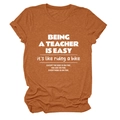 Detail of rust red teacher quote t-shirt showing breathable fabric texture and white print - Burnt Orange (White Font)