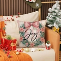 Funda de cojín navideño de lino rosa con corona Joy y lazo decorativo en sofá - Corona Joy y Lazo Rosa (YMA36-4)