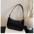 Close-up of black lychee grain crescent underarm bag with silver zipper and leather strap - Black