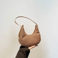 Brown woven crescent underarm bag with caramel fabric texture and slim shoulder strap - Brown