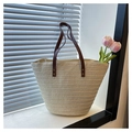 Close-up of woven straw tote bag with brown leather handles and vintage metal rivets - Off-white without Silk Scarf