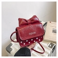 Chic red crossbody bag with a large bow and white polka dots on glossy leather - Red