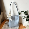 Light blue faux leather tote bag with crinkled texture and cream lace bow decoration - Blue