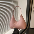 Pink minimalist crescent shoulder bag with embossed fashion text and smooth faux leather finish - Pink