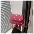 Detailed view of pink polka dot crossbody bag with matching slim shoulder strap - Rose Pink