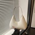 Chic beige hobo shoulder bag with fashion lettering in a sleek minimalist design - White
