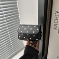 Retro black crossbody bag with white polka dots featuring a chic flap design - Black