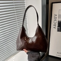Glossy dark brown patent leather hobo bag with embossed logo and elegant shoulder strap - Brown