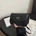 Fashionable black crossbody square bag with elegant gold metal bow detail for women - Black