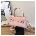 Close-up of pink mini square bag featuring a delicate bow and premium PU leather texture - Pink