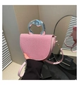 Detail of pink woven saddle bag with unique silver metallic handle and leather strap - Pink