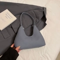 Minimalist dark grey woven underarm bag with silver feet and a matte texture finish - Blue