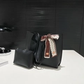 Black matte tote bag set with patterned silk scarf in a modern minimalist studio setting - Black