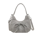 Grey minimalist shoulder bag with soft bow detail and adjustable strap on white background - Silver