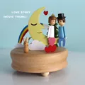 Wooden music box with moon and rainbow design playing Love Story theme - Date Under the Moon (1537)