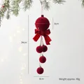 Flocked red Christmas bell ornament with ribbon bow hanging on festive tree branches - Bell Bowknot Ball Hanging Ornament