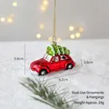 Red retro car glass ornament with Christmas tree on snowy background and gold string - Car