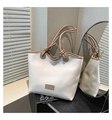 Detail of the woven texture and knotted shoulder strap on this contrast tote bag - White