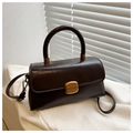 Close-up of retro dark brown handbag with gold metal clasp and oil-wax leather texture - Dark Brown