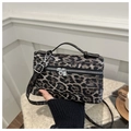 Close-up of leopard print crossbody bag with silver hardware and adjustable strap - Black