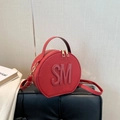 Rote runde Handtasche mit SM-Prägung und goldenem Kettenriemen für Damen - Rot