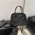 Glossy black luxury tote bag with adjustable strap and decorative buckle for women - Black