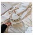 Detail of a creamy white PU leather mini chain bag with stylish chunky plastic accents - White