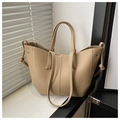 Detail of beige pebbled leather tote bag with contrast stitching and layered design - Khaki