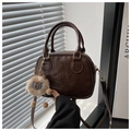 Detail of vintage brown bowling bag with embossed lucky LHCO Smu text and plush charm - Coffee with Pendant