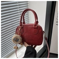 Detail of red textured PU leather handbag with lucky lettering and cute plush charm - Burgundy Red With Charm