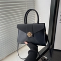 Classic black tote bag with gold floral clasp for women, featuring dual-use straps - Black