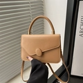 Light brown matte leather top handle bag with oval buckle and gold metal hardware - Khaki