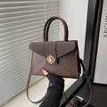 Chic dark brown envelope shoulder bag with matte leather and floral metal buckle - Brown