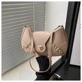 Detail of beige shoulder bag featuring a gold metal twist-lock and retro rivet accents - Khaki