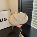 Pochette da sera oro champagne con paillettes, chiusura a fiocco e catena fine - Oro