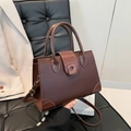Brown crocodile pattern patchwork tote bag on office chair with a chic cream blazer - Brown