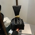 Minimalist black pleated bucket bag featuring elegant gold metal pebble handles - Black