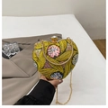 Elegant heart-shaped evening bag featuring yellow leaf embroidery and sequin floral details - Yellow