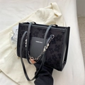 Fashionable black tote bag with floral embossing and decorative pearl chain accessory - Black