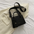 Minimalist black square handbag with wide shoulder strap and matching coin purse - Black