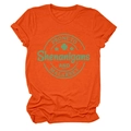 Detailed view of the green St. Patrick's Day graphic print on an orange crewneck T-shirt - Orange