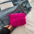 Modern rose red quilted pouch made of shiny fabric held by hand for storage - Rose Pink