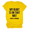 Detail of yellow cotton T-shirt featuring My Heart Is On That Mat and Wrestling Mom print - S / Black Font / Yellow