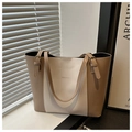 Detail of contrast color tote bag showing adjustable straps and gold metal hardware - Color Block Khaki