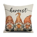 Linen autumn throw pillow cover featuring three gnomes holding pumpkins with harvest text - Gnome Pumpkin (Harvest)