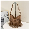 Detail of bohemian khaki suede shoulder bag featuring long fringe tassels and metal hardware - Khaki