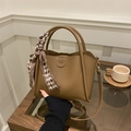 Fashionable khaki bucket handbag in lychee grain leather with elegant scarf detail - With Pendant / Brown